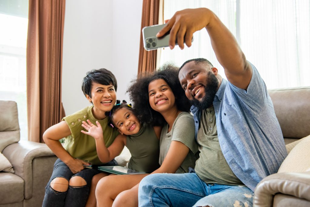 A happy family posing for a selfie